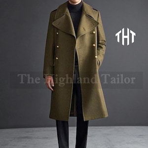 May include: Olive green double-breasted overcoat with gold-colored buttons. The coat has a wide lapel and a long, tailored fit. The text "The Highland Tailor" is printed on the bottom of the coat.