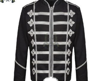 May include: Black jacket with white horizontal and vertical stripes, and decorative silver-colored cross-shaped embellishments. The jacket has a high collar and a zipper closure. The sleeves are long, and the jacket has a tailored fit.