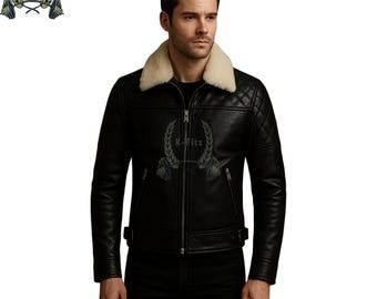 May include: Black leather jacket with a cream-colored shearling collar. The jacket features a quilted shoulder design, a front zipper, and two side pockets. The jacket has a logo on the chest.