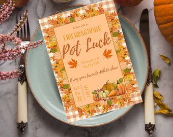 May include: A Friendsgiving Pot Luck invitation card with a fall theme. The card features pumpkins, leaves, and the text "Friendsgiving Pot Luck". The invitation is on a plate with a fork and knife.