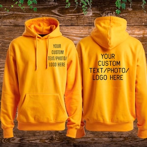 May include: A bright yellow hooded sweatshirt shown from the front and back. The front features a kangaroo pocket and the text "YOUR CUSTOM TEXT/PHOTO/LOGO HERE" printed in black. The back displays the same text in black on the centre.