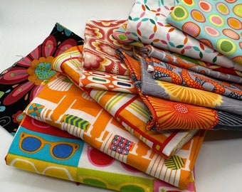 Orange fabrics scraps for quilting, sewing, fun art