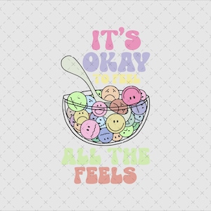 May include: A digital illustration features a bowl of colorful smiley face cereal with a spoon. The text "IT'S OKAY TO FEEL ALL THE FEELS" is written above and below the bowl in pastel colors. The background is a light gray.
