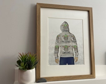 Make your own keepsake with outgrown baby clothes or sentimental clothing items, and hang it up! - The hoodie.