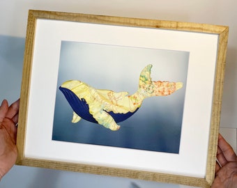 Make your own keepsake with outgrown baby clothes or sentimental clothing items, and hang it up! - The whale.