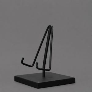 May include: A matte black metal display stand featuring a square base and a vertical support structure with two angled arms designed to hold items upright. The stand has a clean, uniform finish and a simple, functional design for tabletop display.