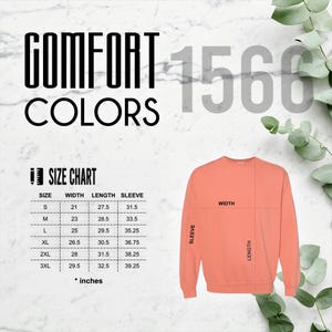May include: Coral-colored sweatshirt with a size chart and the words "COMFORT COLORS" in black. The size chart shows measurements in inches for width, length, and sleeve length. The number "1566" is in the background.