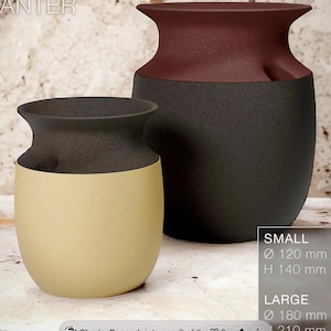 May include: Two ceramic vases, one small and one large, with a textured finish. The small vase is beige and black, while the large vase is black and burgundy. The small vase is 120 mm in diameter and 140 mm high. The large vase is 180 mm in diameter and 210 mm high.