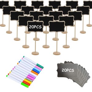 May include: A set of 20 small chalkboard signs with wooden stands, ideal for table settings or labeling. Includes a set of colorful markers for writing. The chalkboard signs have a decorative, scalloped edge.