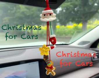May include: A festive crocheted car charm with a Santa Claus head, a mitten, a star, a candy cane, and a gingerbread man. The charm is red, white, yellow, and green. The text "Christmas for Cars" is visible.
