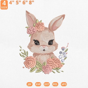 May include: An embroidered design of a bunny with a floral crown and surrounding flowers. The design is available in sizes 4", 5", 6", and 8". The bunny has large eyes and is surrounded by pink and green flowers. The design is available in JEF, EXP, DST, PES, and VP3 formats.