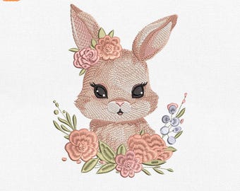 May include: An embroidered design of a bunny with a floral crown and surrounding flowers. The design is available in sizes 4", 5", 6", and 8". The bunny has large eyes and is surrounded by pink and green flowers. The design is available in JEF, EXP, DST, PES, and VP3 formats.