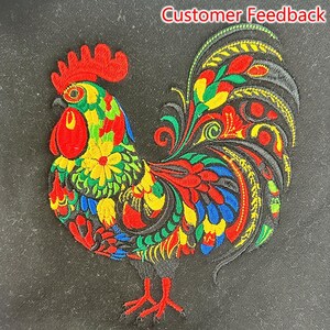 May include: Embroidered patch featuring a colorful rooster design. The rooster has a red comb and wattle, with a body of red, yellow, green, and blue. The patch is on a black background. Text at the top reads "Customer Feedback."