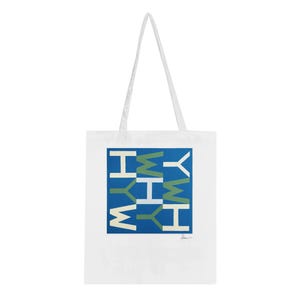May include: White tote bag with a blue square graphic featuring the word "WHY" in white and green block letters. The bag has white handles and is made of a durable fabric.