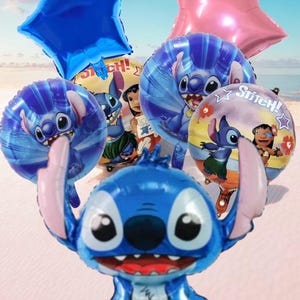 May include: A collection of foil balloons featuring the character Stitch from the animated film. The balloons are blue, pink, and yellow, with star and round shapes. The background shows a beach scene.