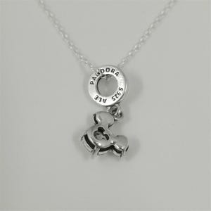 May include: A silver necklace featuring a Pandora charm. The charm includes a circular pendant with the brand name and a smaller ampersand charm. The necklace is displayed against a white background.