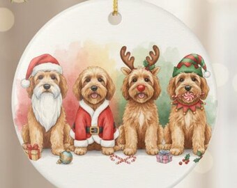 May include: A round Christmas ornament featuring four dogs dressed in holiday attire. One dog is dressed as Santa Claus, another in a red suit, a third with reindeer antlers, and the last with an elf hat and candy cane. The background has a watercolor effect.