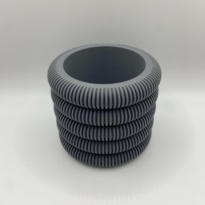 May include: A rustic wooden sign with the text "Welcome to our home" in white lettering. The sign has a distressed finish and a simple, inviting design, ideal for entryway decor.