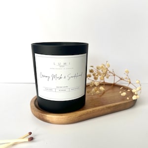 Luxury Scented Creamy Musk & Sandalwood Candle in a Black Matte Glass Vessel. Hand poured, Natural Soy, Eco packaging.