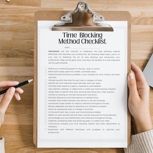 May include: A clipboard with a checklist titled "Time Blocking Method Checklist" is held by two hands. A pencil rests on the paper. The checklist includes instructions and steps for time management. A laptop is partially visible in the background.