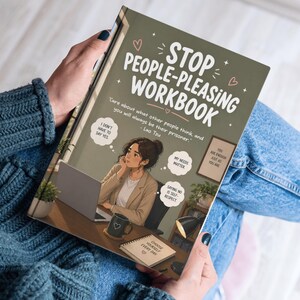 May include: A workbook titled "Stop People-Pleasing Workbook" is held by a person. The cover is olive green with white text and an illustration of a woman at a desk. The book includes quotes and phrases like "I don't have to say yes."