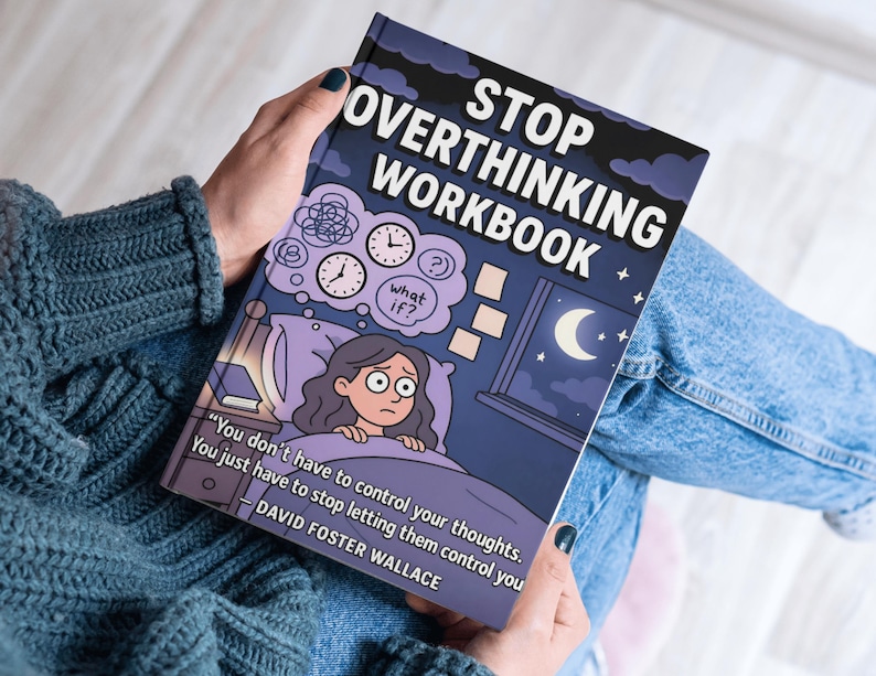 May include: A person holds a workbook titled "STOP OVERTHINKING WORKBOOK". The cover illustration depicts a person in bed, with thought bubbles and clocks. The book's cover is dark blue with white text and a quote by David Foster Wallace.