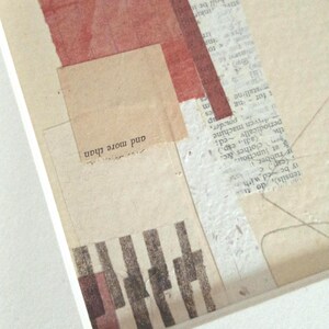 May include: Abstract collage art piece featuring torn paper elements in beige, red, and white. The composition includes text fragments and a rectangular shape with the words "and more than".