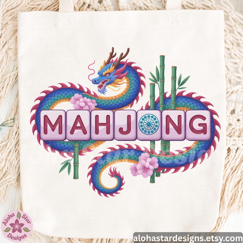 May include: Cream-colored tote bag featuring a colorful illustration of a dragon, bamboo stalks, and pink flowers. The word "MAHJONG" is displayed in pink block letters. The bag has a design from alohastardesigns.etsy.com.