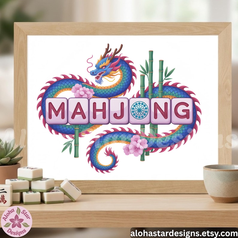 May include: A framed print featuring the word "MAHJONG" in pink tiles, with a blue and purple dragon design. Bamboo stalks and pink flowers surround the text. Mahjong tiles are visible on a wooden shelf, with the Aloha Star Designs logo.