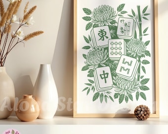 May include: A framed print featuring a green and white illustration of Mahjong tiles, chrysanthemums, and bamboo stalks. The print is in a light wood frame and is displayed on a white shelf with decorative vases and a pinecone.