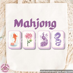 May include: A white tote bag with the word "Mahjong" in purple. Below the text are four rectangular tiles with watercolor illustrations: a koi fish, a chrysanthemum, a peacock, and a dragon. The shop's name is in the bottom left corner.
