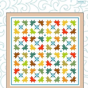 May include: A quilt pattern titled "Beleaf You Me" with a finished size of 67" x 67". The quilt design features colorful leaf shapes in shades of red, green, yellow, and brown, set against a white background. The quilt is framed with a tan border.