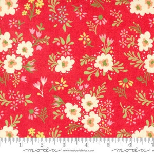 May include: Red fabric with a white floral pattern. The fabric has a small-scale floral print with white flowers and green leaves on a red background.
