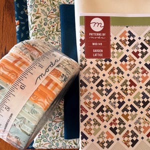 May include: A collection of fabric bundles and patterns. The fabric bundles are wrapped with a ruler-like ribbon. The patterns are labeled "Patterns by Moda" and "Garden Lattice". The fabrics feature floral and geometric designs in shades of orange, blue, and green.