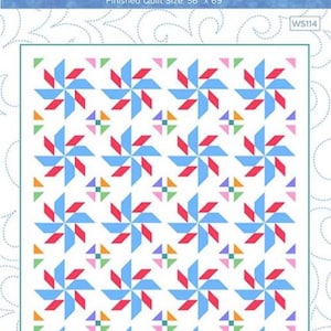 May include: A quilt pattern titled Reels & Trills by Wendy Sheppard featuring a white background with repeating pinwheel blocks in red and light blue, accented by small multi-colored squares. The finished quilt size is 56 inches by 69 inches.