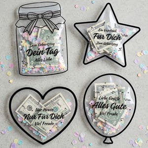 Puede incluir: Cuatro portaregalos transparentes con forma de tarro, estrella, corazón y globo, cada uno lleno de confeti y billetes de dólar estadounidense. Se puede ver texto en alemán en cada portaregalos, incluyendo "Dein Geburtstag", "Nur Für Dich".