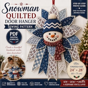 May include: A snowman quilted door hanger sewing pattern featuring a central snowman face with a blue knit hat and red scarf, surrounded by blue and white snowflake-patterned fabric petals. The finished size is 61 cm by 71 cm.