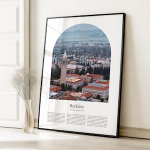 May include: A framed print depicting Berkeley, California, United States. The image, framed in black, shows a cityscape through an arch, with a clock tower and buildings. The word "Berkeley" is printed at the bottom of the print.