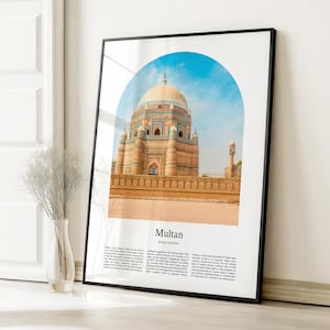 May include: Framed print featuring a photograph of a historical building in Multan, Pakistan, under a blue sky. The building has a large dome and intricate architectural details. The word "Multan" is printed below the image.