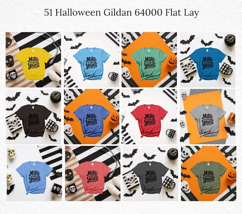 May include: A flat lay featuring a variety of Gildan 64000 t-shirts in various colors, each with the text "Make it Yours" in a black, stylized font. The shirts are arranged with Halloween-themed decorations, including bats, skulls, and pumpkins.