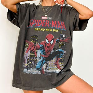 May include: A set of three ceramic mugs with a speckled, matte finish. The mugs are in shades of cream, light gray, and dark gray. Each mug has a simple, minimalist design, perfect for coffee or tea.