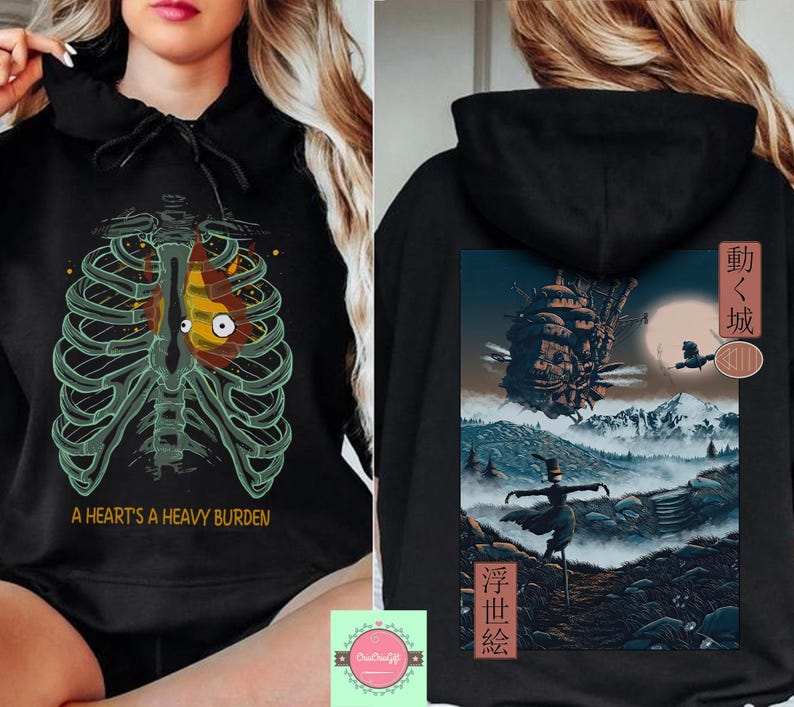 May include: Black hoodie featuring a rib cage design with a heart-shaped graphic and the text "A Heart's a Heavy Burden." The back of the hoodie displays a landscape scene with a castle, a scarecrow, and Japanese text.