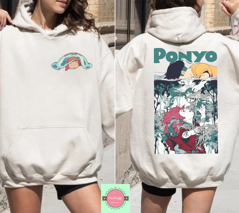 May include: Cream-colored hoodie with a front pocket and a hood. The front features a small cartoon graphic. The back displays the word "PONYO" in green, along with a colorful anime-style illustration of characters from the movie.