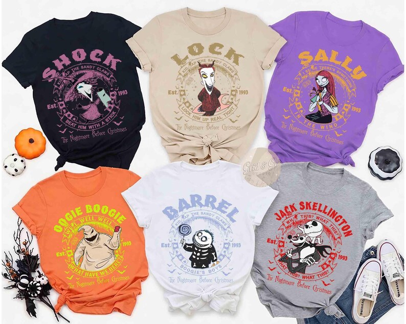May include: Six short-sleeve crew neck t-shirts featuring characters from The Nightmare Before Christmas. Colors include black, beige, purple, orange, white, and gray. Each shirt displays a unique character graphic with text and a circular border.