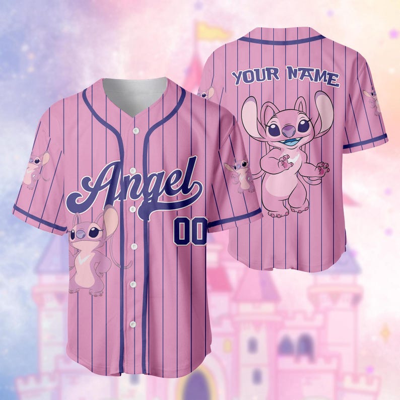 May include: Pink baseball jersey with vertical pinstripes and the word "Angel" in script. The jersey features a cartoon character and the number "00". The back of the jersey has the text "YOUR NAME".