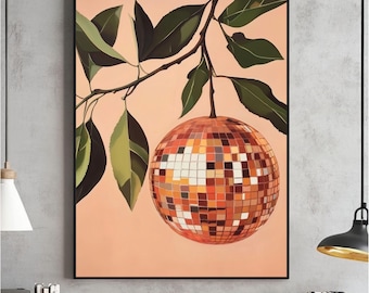 May include: A framed art print featuring a disco ball design. The disco ball is composed of small, square tiles in shades of orange, brown, and gold. Green leaves and a branch are positioned above the disco ball against a peach-colored background.