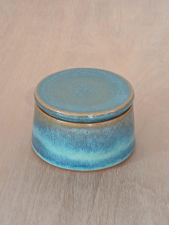A handmade ceramic lidded jar with 85 favorites that moonlights as a salt cellar, candy dish, or jewelry pot — versatile, functional craft at $13.
