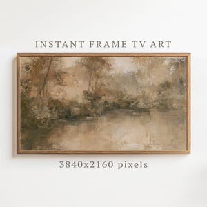 Puede incluir: Una obra de arte digital rectangular titulada INSTANT FRAME TV ART 3840x2160 pixels, enmarcada en madera clara. La imagen presenta una pintura paisajística impresionista de árboles reflejados en un cuerpo de agua tranquilo en tonos beige, marrón y verde.