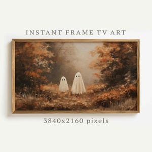 Könnte beinhalten: Gerahmter digitaler Kunstdruck mit zwei weißen Geisterfiguren in einer Waldszene. Das Kunstwerk hat eine Vintage-Ästhetik mit warmen Herbstfarben, darunter Brauntöne, Orange und Gelb. Der Text "INSTANT FRAME TV ART" steht oben.