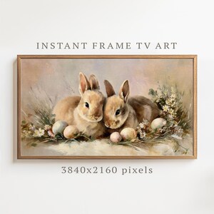 May include: A framed digital art print depicting two brown rabbits with pastel Easter eggs and white flowers. The text "INSTANT FRAME TV ART" is displayed at the top. The image is 3840x2160 pixels.